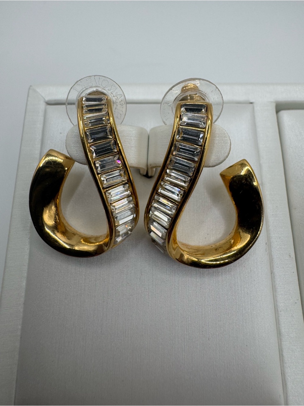 Vintage 1990s Signed Swarovski Baguette
Crystal Gold Ribbon Twist Hoop Earrings